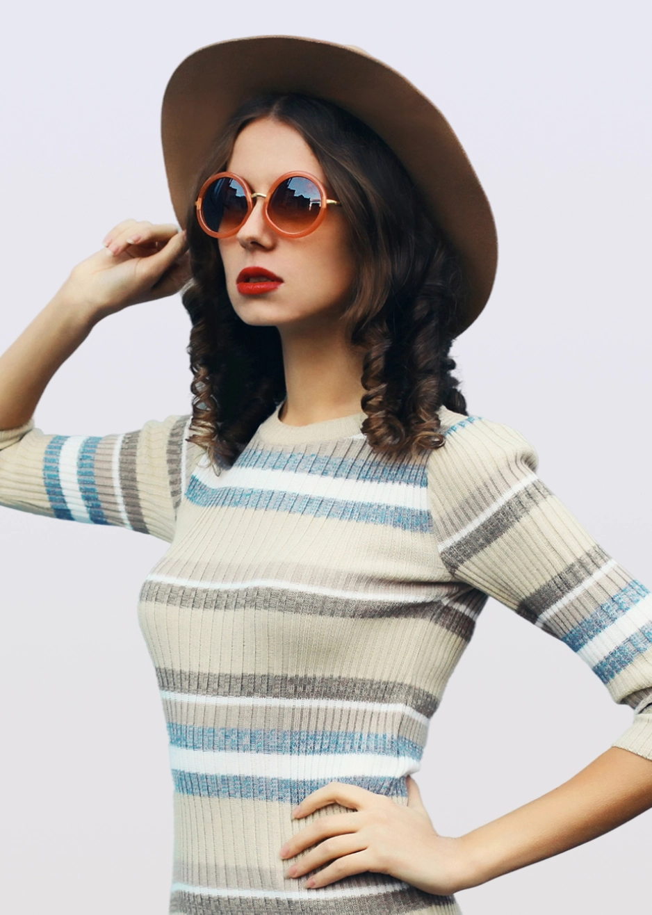 Stylish woman wearing sunglasses and hat